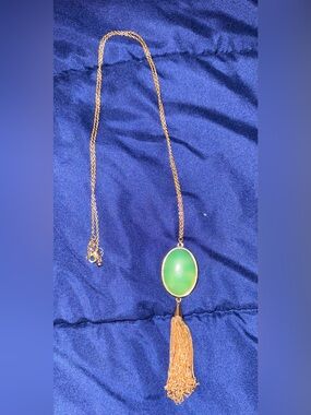 Gold-Tone Necklace with Green Oval Pendant and Tassel